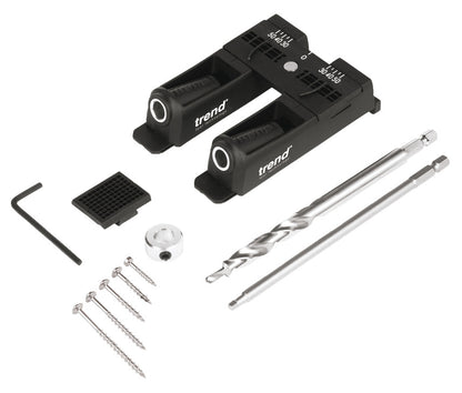 Trend brand dual-angle drill driver kit with two black quick-release driver housings, two silver metal driver bits, six screws, a hex key, and a small mounting piece on a white background.